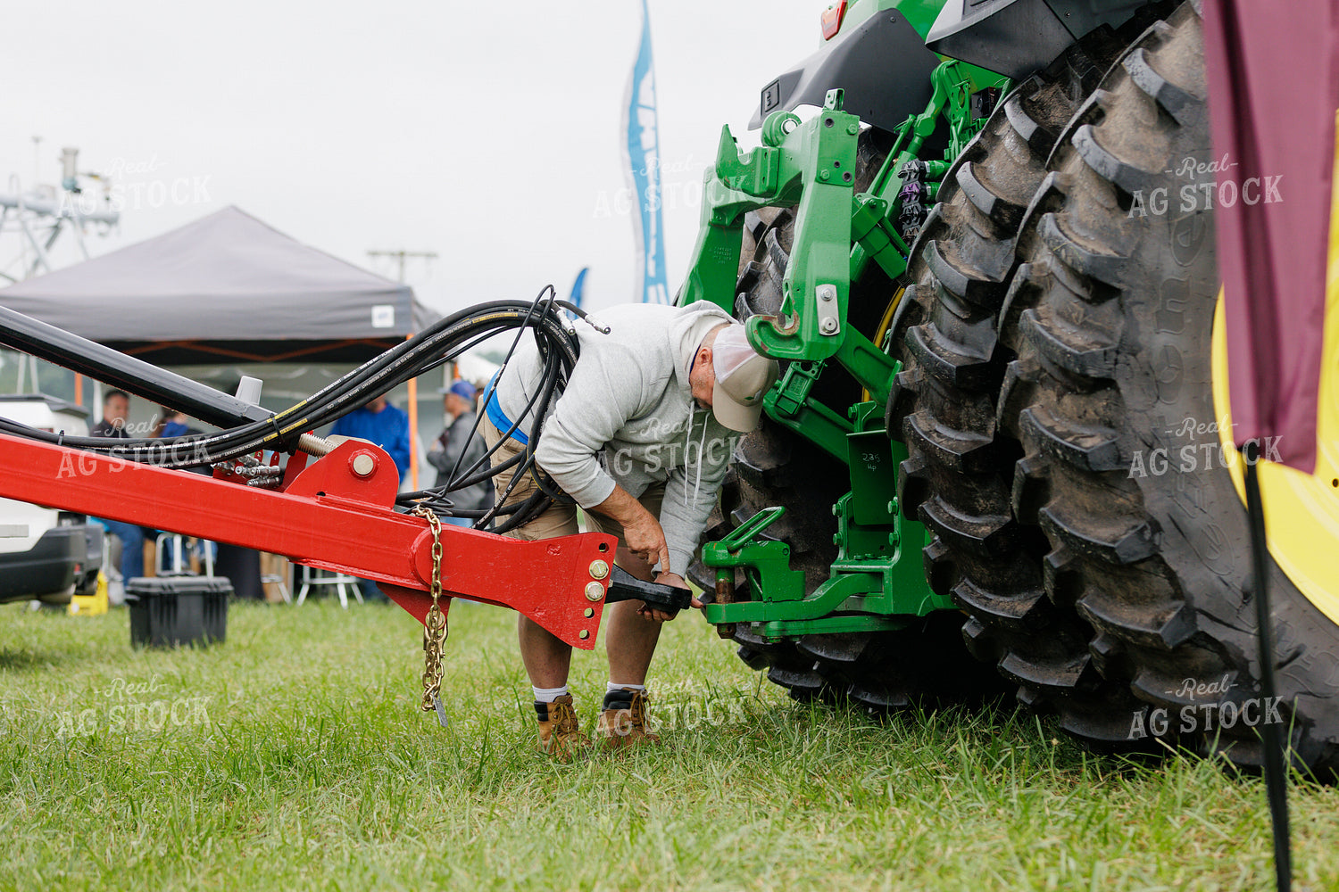 Farmer Hooking Equipment up to Hitch 52975
