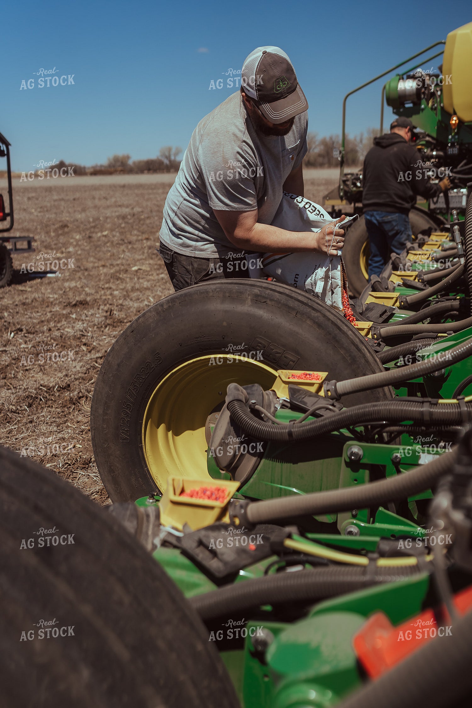 Farmer Filling Planter for Test Plot 196122