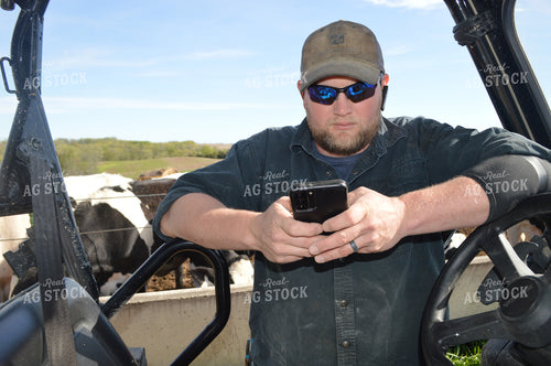 Farmer on Phone on Side by Side 206007
