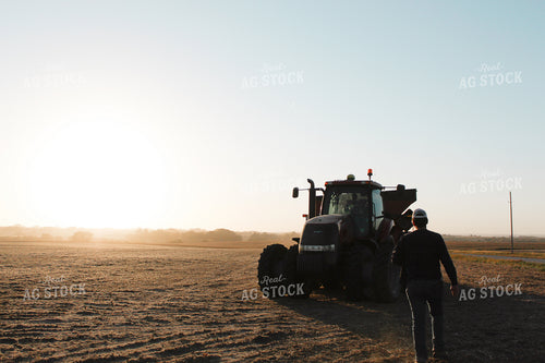 Farmer Walking Towards Grain Cart 123000