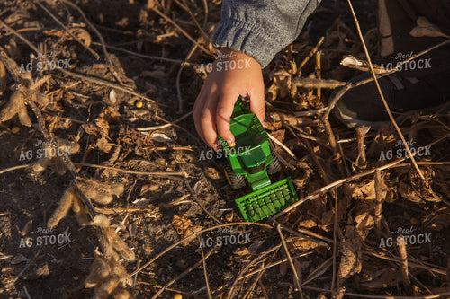 Farm Kid Driving Combine Toy in Field 67848