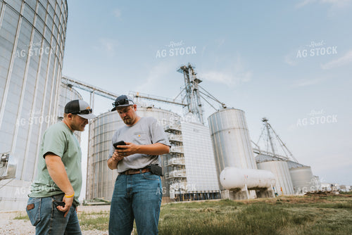 Farmers Talking by Grain Bins 7799