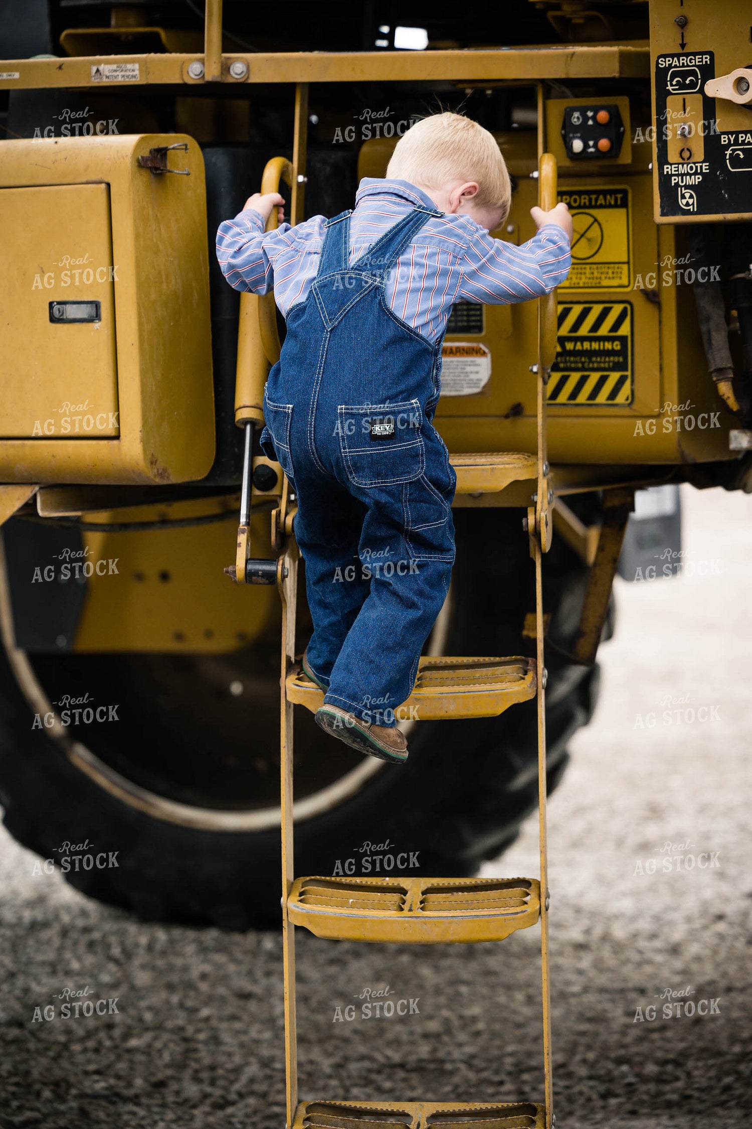 Farm Kid Climbs off Tractor 219065
