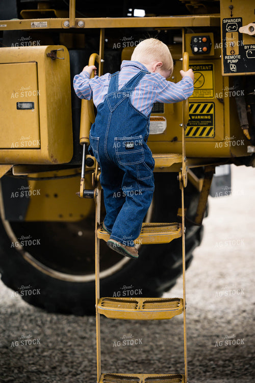 Farm Kid Climbs off Tractor 219065