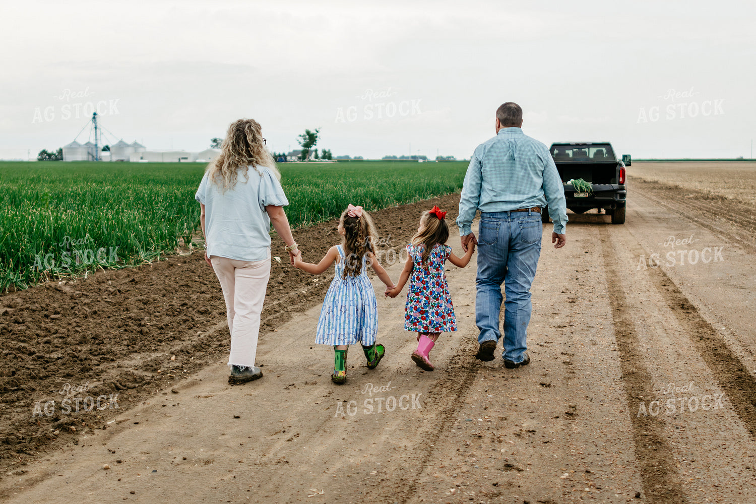 Farmers and Farm Kids Walking on Gravel Road 218070