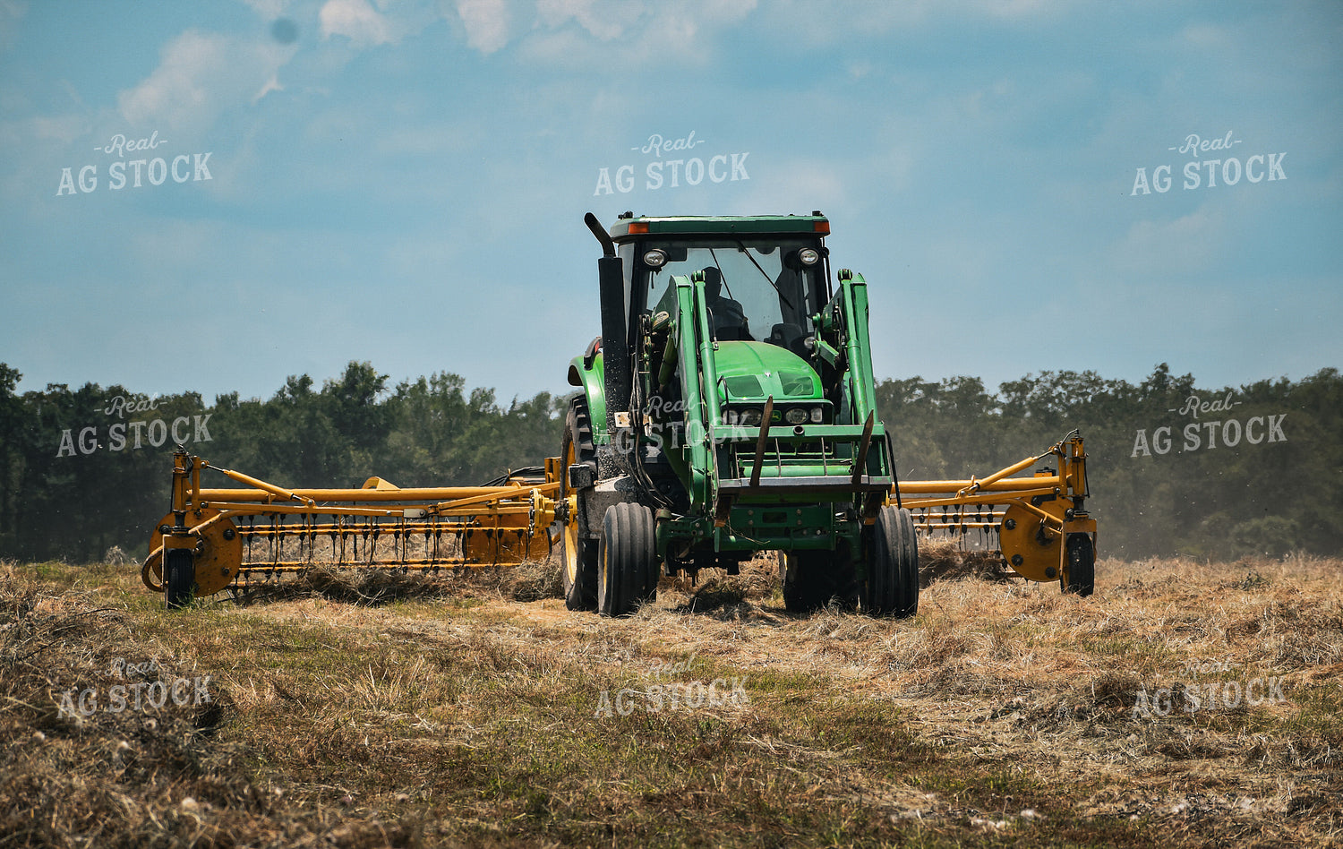 Front-End Loader Tractor Raking Hay 112018