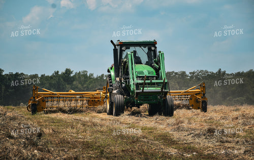 Front-End Loader Tractor Raking Hay 112018