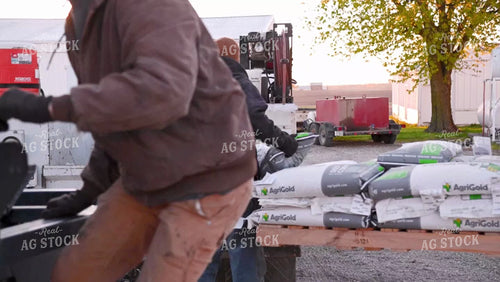 Loading Seed Bags into the Truck - 059