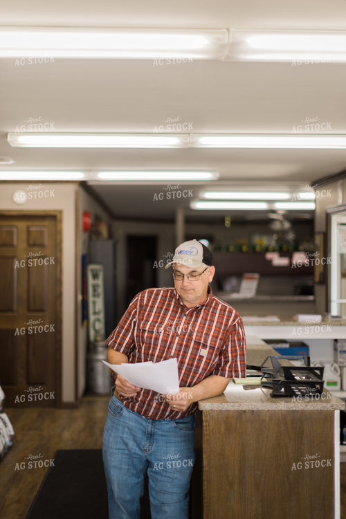 Retailer Working in Office 8081