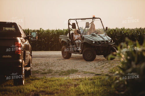 Farm Kids in UTV Alongside Corn Fields 4543