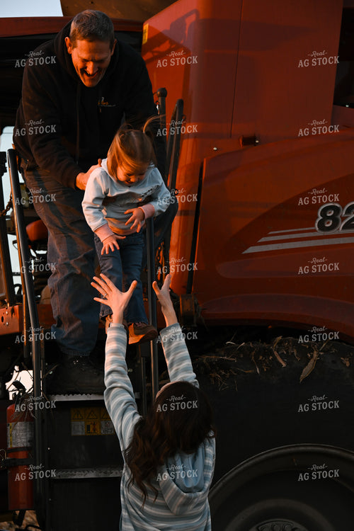 Farm Family Climbing Out of Combine 26309