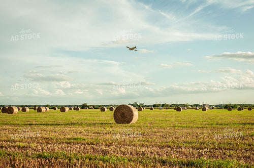 Round Hay Bale Landscape with Crop Duster Flying Overhead 59005