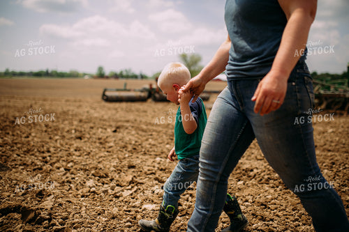 Farm Family Walking by Tractor 169084