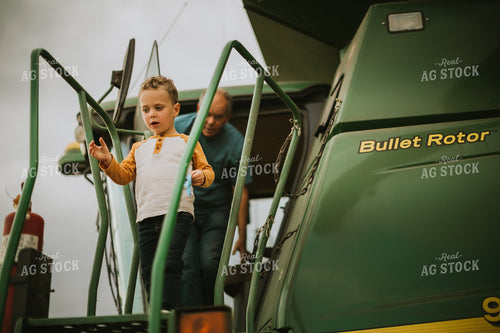 Farm Kid Getting out of Combine 6613