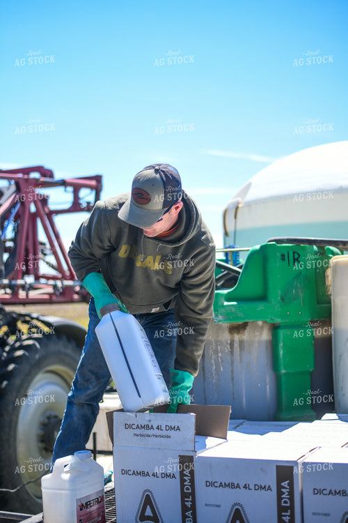 Farmer Mixing Chemicals for Self Propelled Sprayer 191061