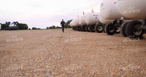 Input Supplier Walking by Anhydrous Tanks 8689