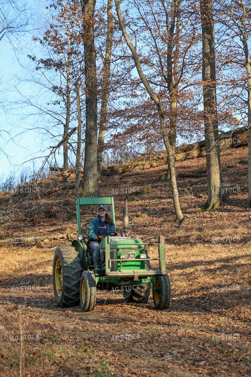 Young Female Farmer on Tractor 52273