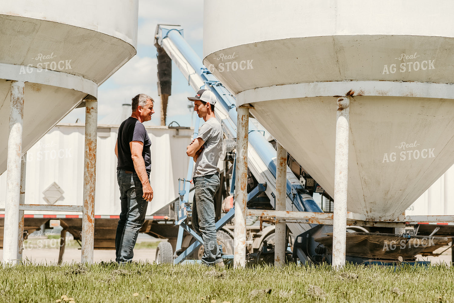Farmers Talking in Farmyard 64258