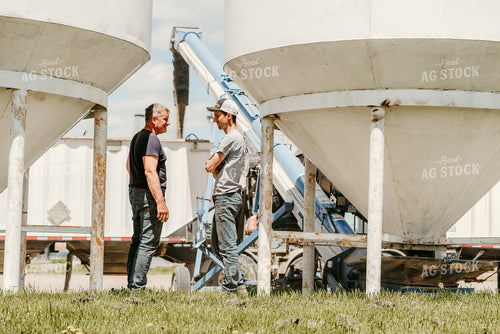 Farmers Talking in Farmyard 64258