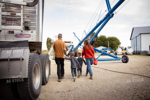 Farm Family Dumping Corn into Grain Pit 268101