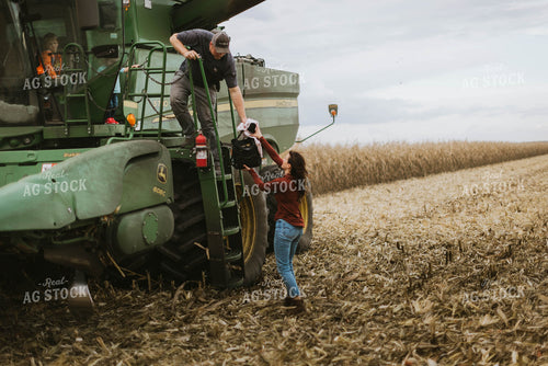 Farm Family Loading Kids into Combine 8559