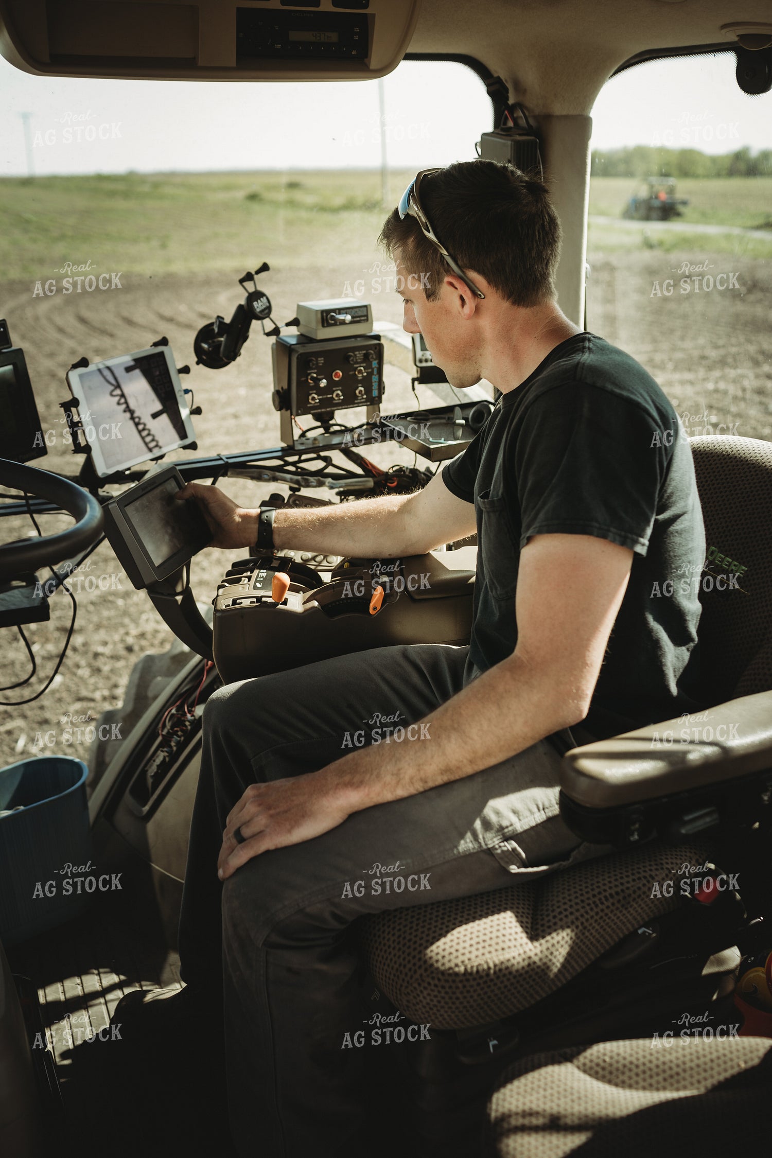 Farmer Adjusting Planter Monitor 4115