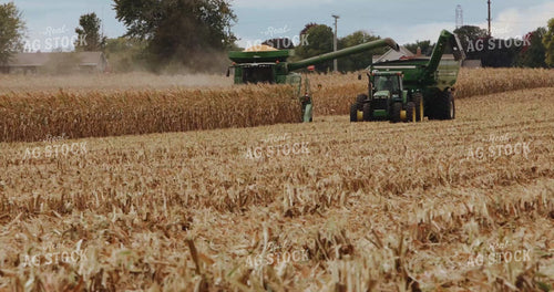 Combine Harvesting Corn and Unloading into Auger Wagon 3916