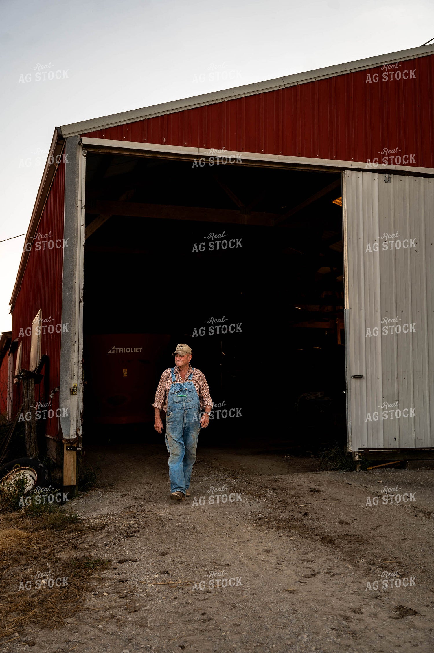 Farmer Walking by Shed 115900