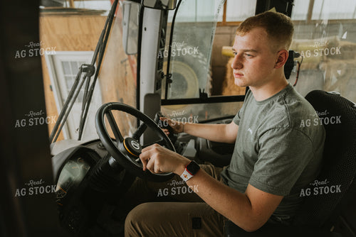 Young Farmer Drives Tractor 7549