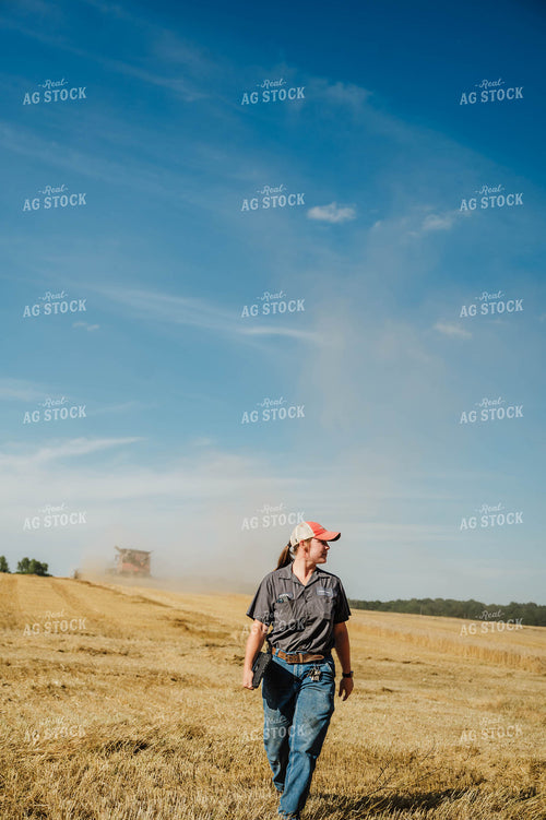 Female Farmer Walking in Field 115229