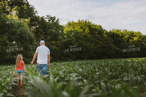Farmer and Daugther Checking Corn 8746