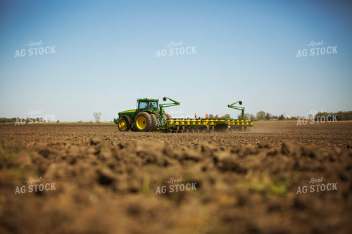 Tractor Pulling Planter in Field 6361