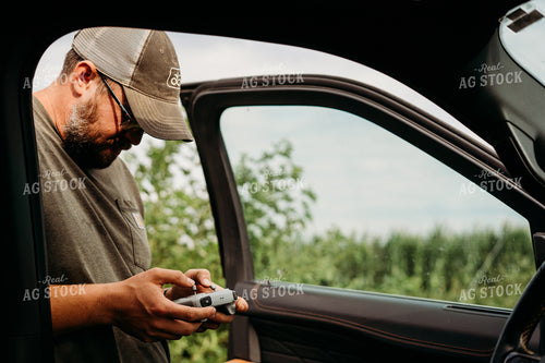 Farmer Holding Drone Controller 196355