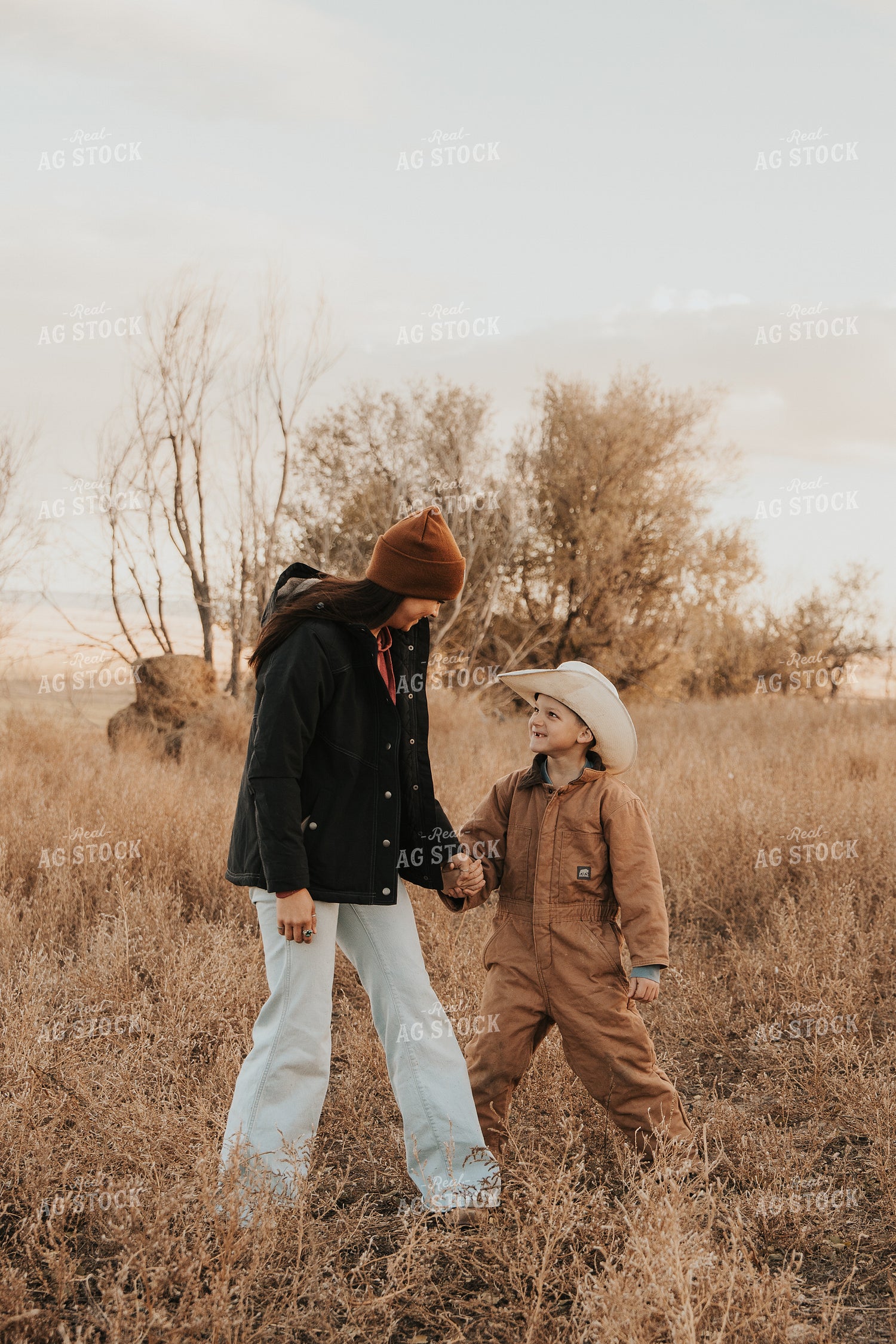 Female Rancher and Kid 61249