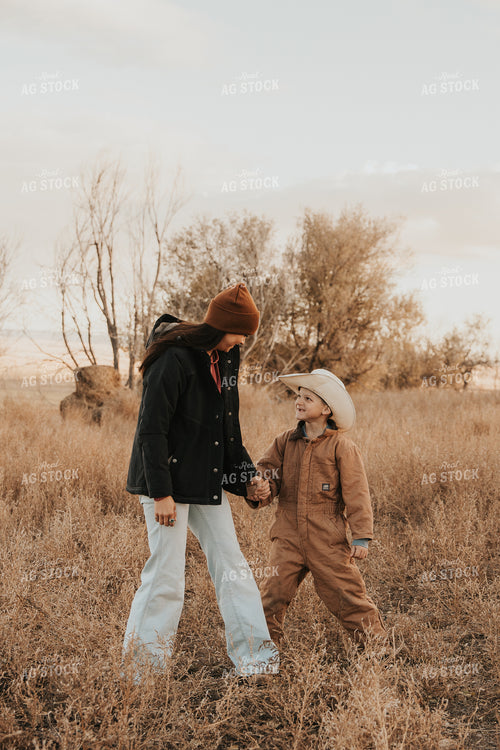 Female Rancher and Kid 61249