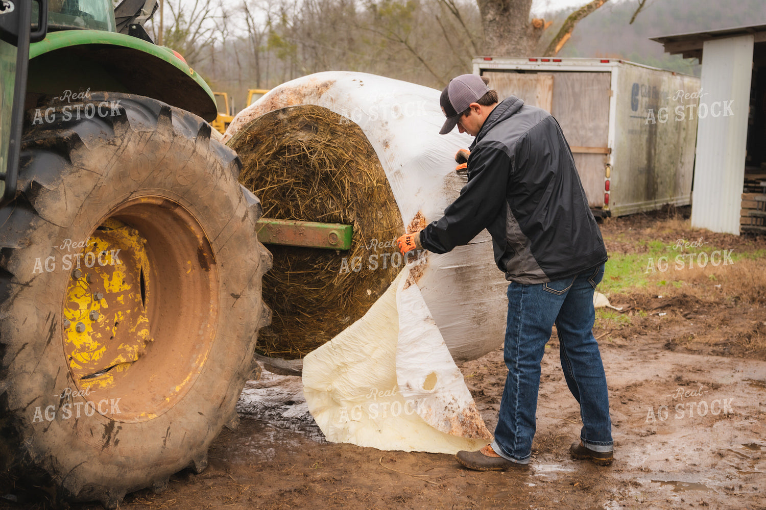 Farmer Wrapping Hay Bale 128010