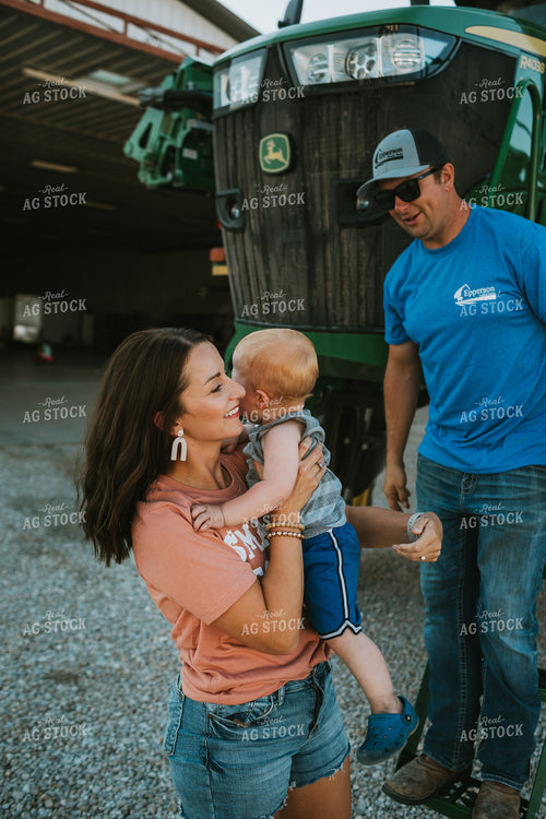 Farm Mom Helping Kids Down from Sprayer 6233