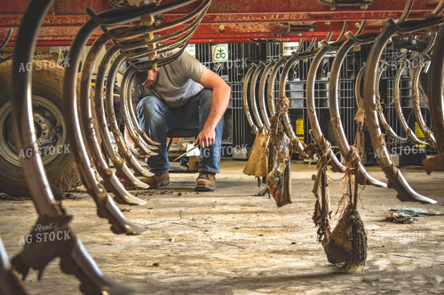 Farmer Working on Chisel Plow 56166