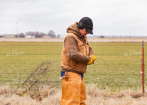 Rancher Fixing Fence 231068