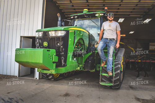Farmer Climbing Out of Tractor 56164