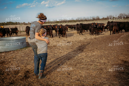 Female Rancher and Daughter Checking Cattle 285025