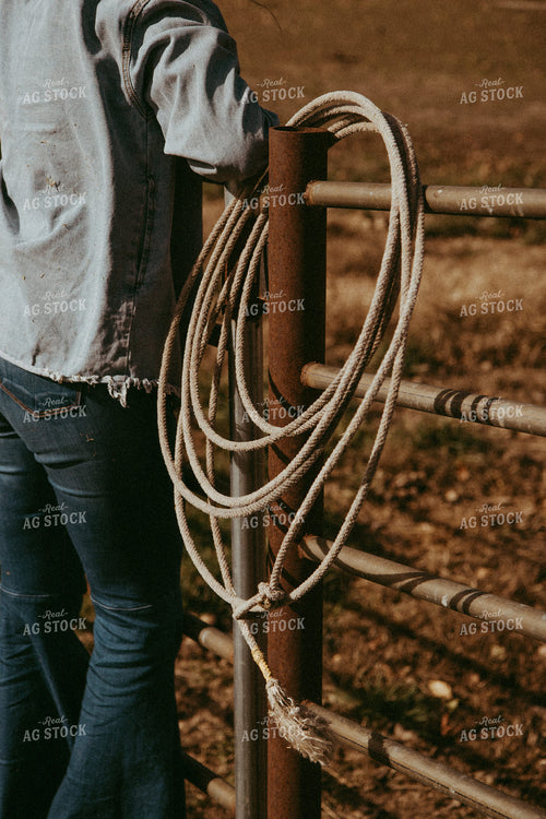 Female Rancher Holding Lasso 67898