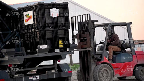 Loading the Seed Tender with a Skidsteer - 100