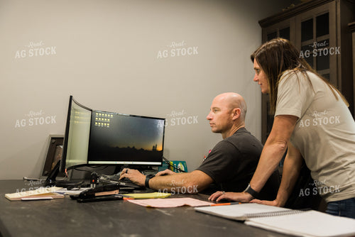 Farmers Work on Computer in Office 7498