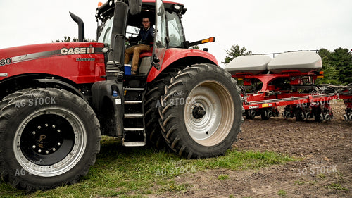 Farmer Climbing into Planter 25149