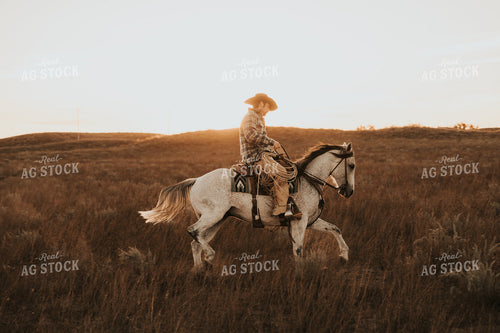 Cowboy Riding Horse 61205