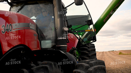 Farmer Climbing into Tractor Cab 25720