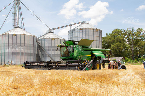 Combine in Wheat Field with Farmers 79054