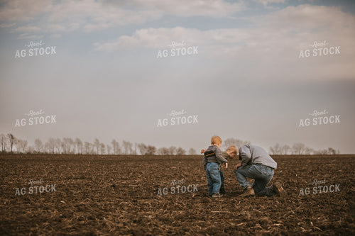 Farmer Checking Seed Depth with Farm Kids 5484