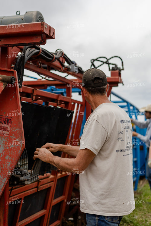 Farmer Operating Cattle Equipment 97203
